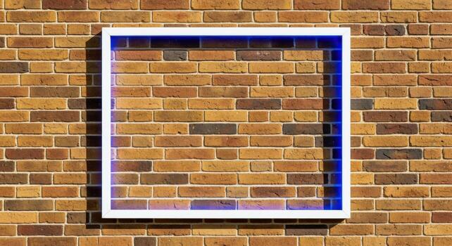 White Square Frame with Blue Light on a Brick Wall, Modern Design for Mockup photo