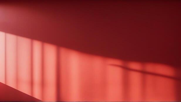 A red wall with a window and a light shining through photo