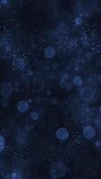 Atmospheric blue abstract background with glittering shiny particles and shimmering bokeh light spheres. Magical stardust effect. Vertical animation. video