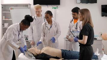 Instructor teaching first aid cardiopulmonary resuscitation course and use of automated external defibrillator video