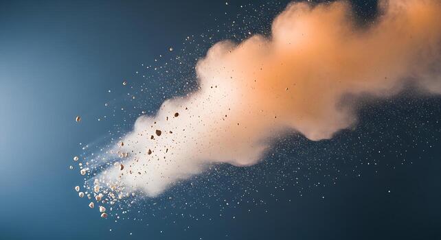 Explosive burst of orange smoke and white particles against a dark blue background creates a dynamic abstract visual photo