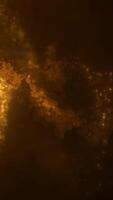 abstrakt gyllene partiklar flytande i en värma, lysande atmosfär, skapande en mystisk, eterisk effekt video