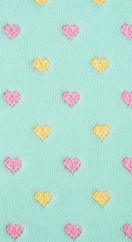 Pastel hearts pattern on a soft turquoise fabric for a cute and playful design photo