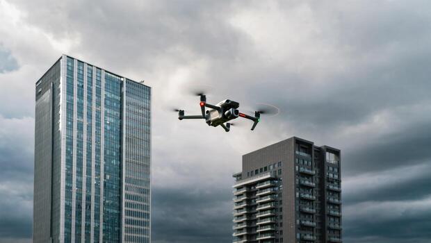 Drone Flying Amidst Tall Buildings Under Cloudy Sky in an Urban Environment photo