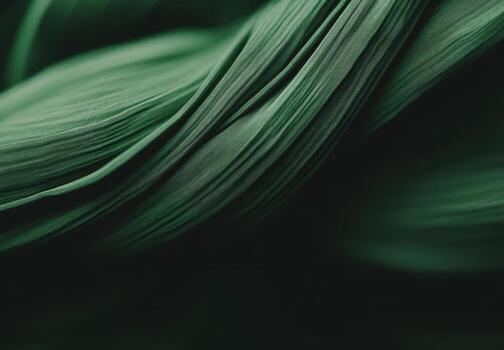 Swirling green fabric showcasing texture and movement in soft lighting photo