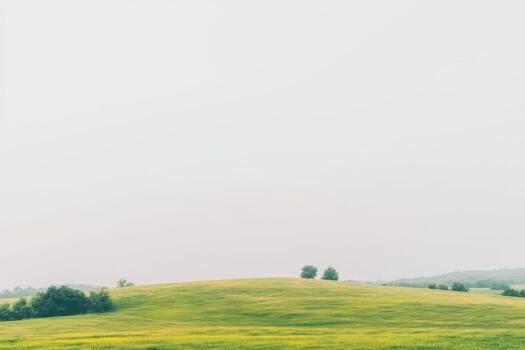 Scenic view of rolling green hills under a clear sky at dawn photo