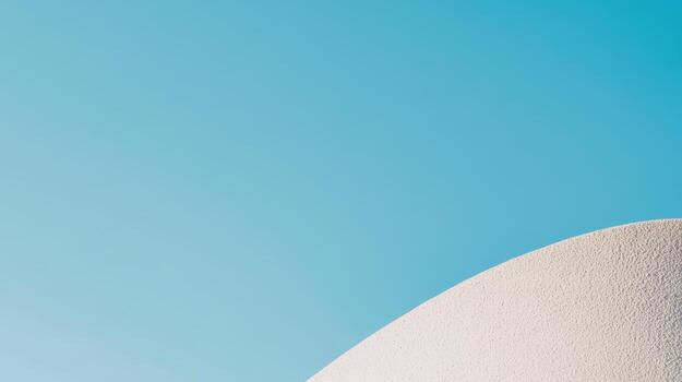 Elegant curvature against a clear blue sky highlights modern architecture design photo