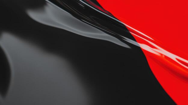 Fluid patterns of black and red paint flowing together in abstract design photo