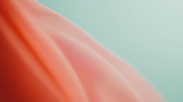 Flowing fabric drapes softly against a light backdrop in gentle colors photo