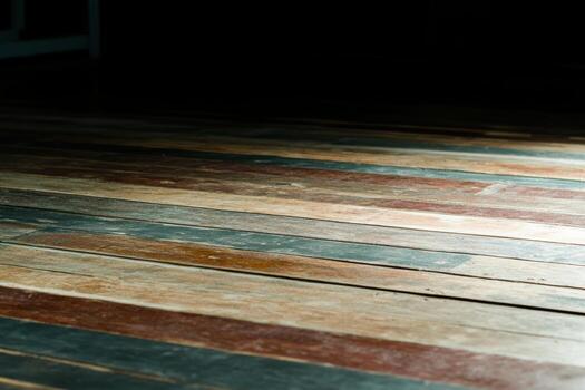 Wooden floor with colorful patterns illuminated by soft light in a quiet room photo