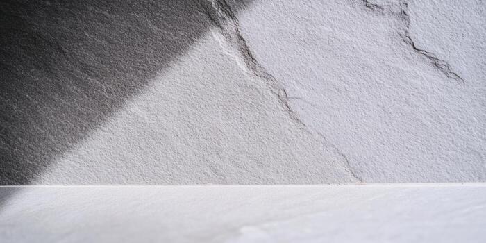 Textured paper surface with shadow and light patterns in a minimalistic setting photo