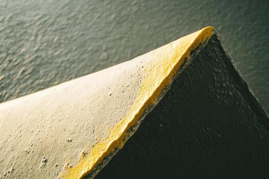 Brightly colored edge of a concrete structure highlights urban design features photo