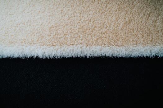 Contrast of soft textures in neutral colors on a cozy blanket setup photo