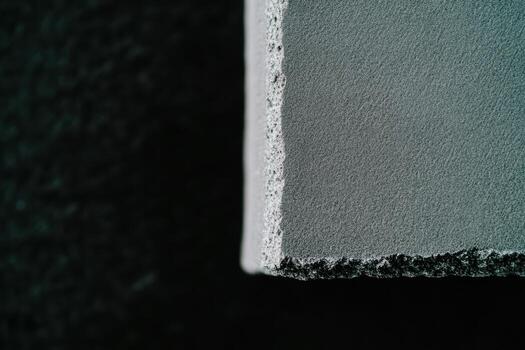 Close-up view of textured concrete surface under natural lighting photo