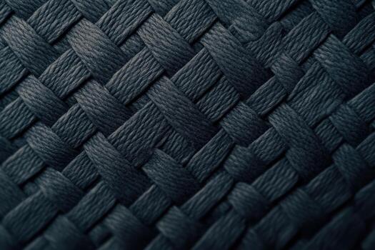 Detailed weaving pattern of dark fibers creates a textured surface photo