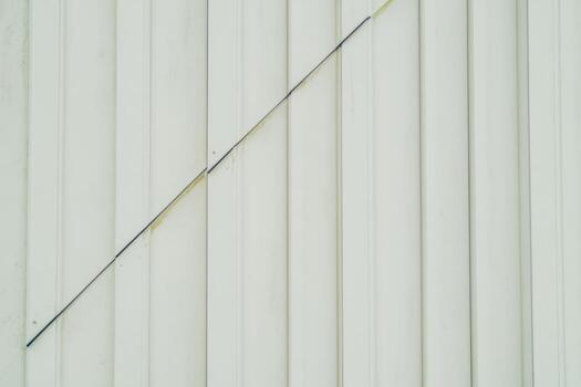 Stylish diagonal black line against clean white textured surface photo