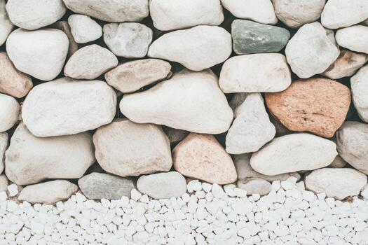 Natural stone wall featuring various shapes and sizes of rocks photo