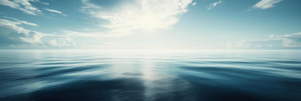 Calm ocean surface reflecting the sun at midday in a serene atmosphere photo