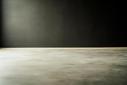 Solid concrete floor with a dark wall backdrop in minimalistic design photo