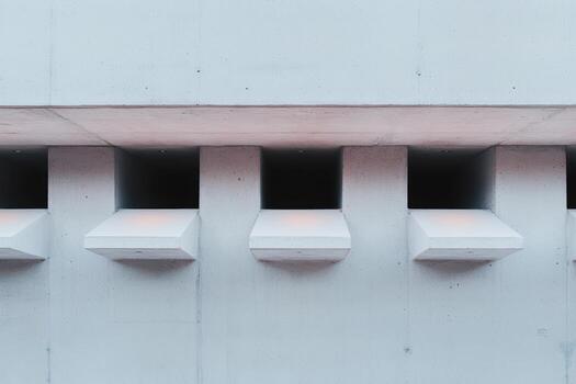Architectural design featuring unique concrete windows on modern building photo