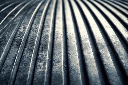 Close-up view of ribbed metal texture in industrial setting photo