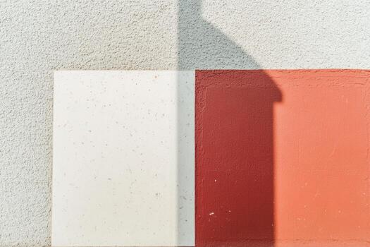 Shadow cast on colorful wall segments during sunny daylight hours photo