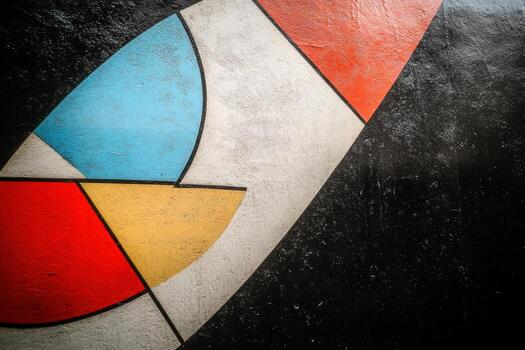 Colorful geometric mural on textured wall in urban setting photo