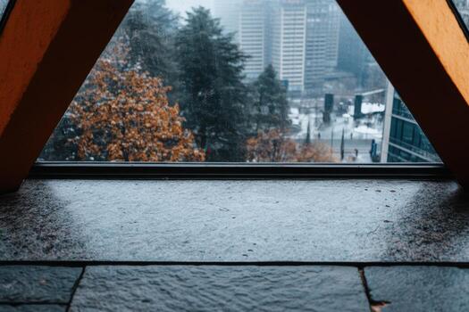 View of urban landscape through a window frame on a gloomy day photo