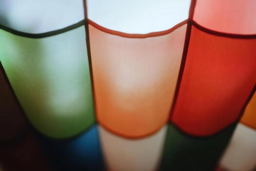 Colorful textile patterns illuminated by soft light in a vibrant setting photo