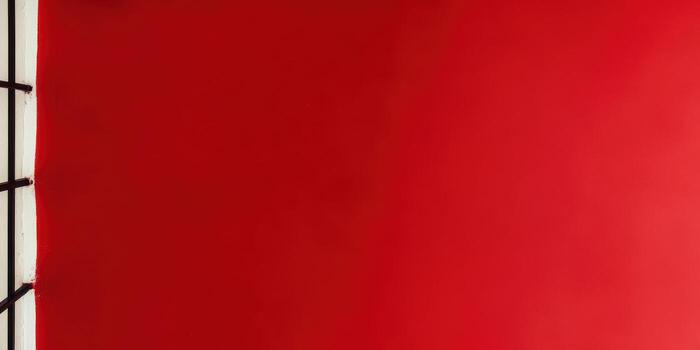 Bright red wall with minimalistic black grid pattern enhancing modern decor photo