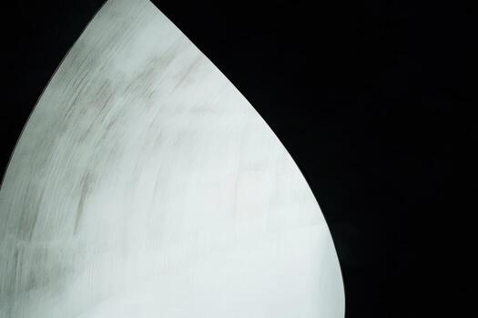 Bright white abstract curve against a dark background showcasing minimalism photo