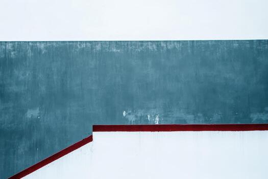 Artistic geometric patterns on a building wall in bright daylight shadows photo