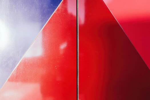 Abstract design of red and blue geometric shapes on a surface photo