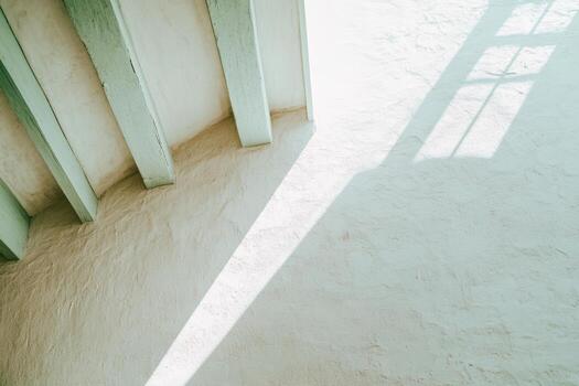 Soft light casts gentle shadows on textured walls in a serene interior space photo