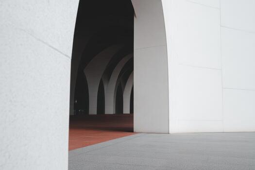 Modern architecture showcases arches in a bright urban setting photo