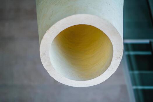 Cylindrical architectural element viewed from below in a modern building photo