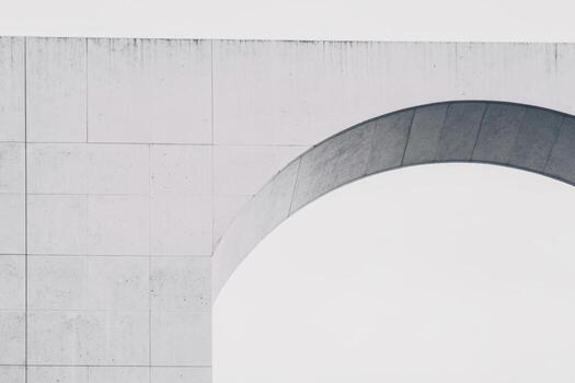 Modern architectural arch against a minimalist background in bright light photo