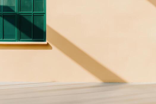 Minimalist architecture with green window and warm wall on sunny day photo
