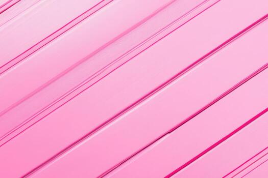Vibrant pink textured surface with diagonal lines in abstract design photo