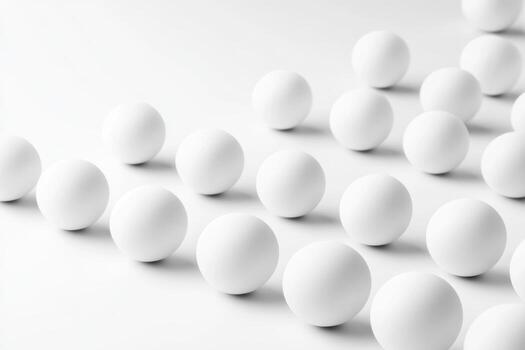 White spheres arranged on a light surface showcase simplicity and elegance photo