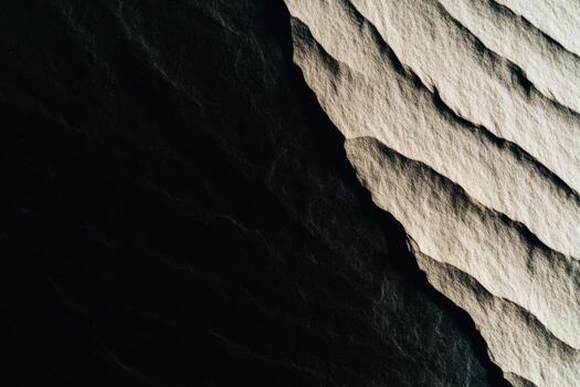 Textured surface with contrasting shadows and waves captured in soft light photo