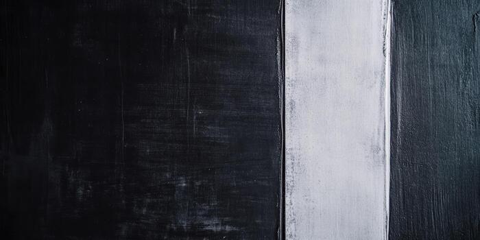 Abstract vertical stripes in contrasting black and white paint on canvas photo