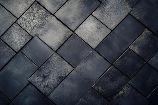 Dark textured tiles arranged in a geometric pattern on a floor photo