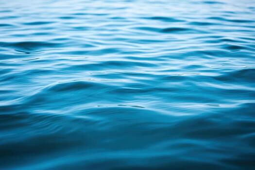 Calm water surface reflecting light on a clear day at a tranquil lake photo
