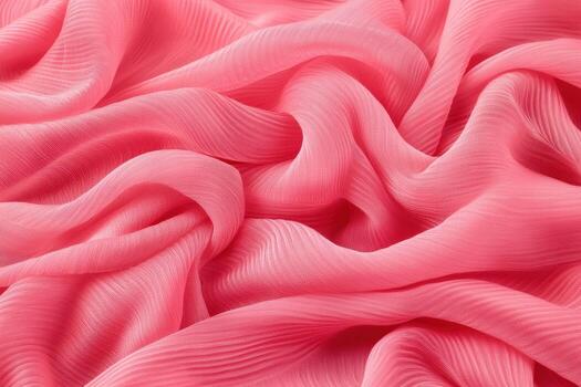 Soft pink fabric draped elegantly on a smooth surface photo