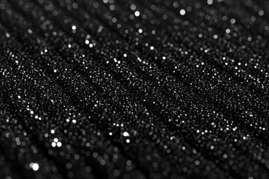 Sparkling black texture with shimmering details creates an enchanting effect photo