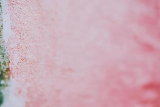 Soft pastel colors blend on a textured wall in an artistic setting photo