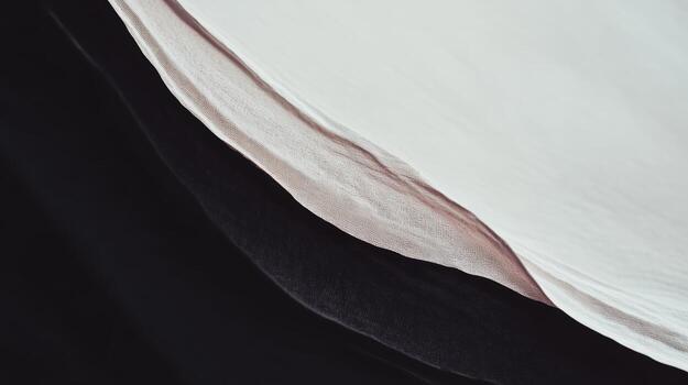 Fabric layers create an abstract composition with soft textures and colors photo