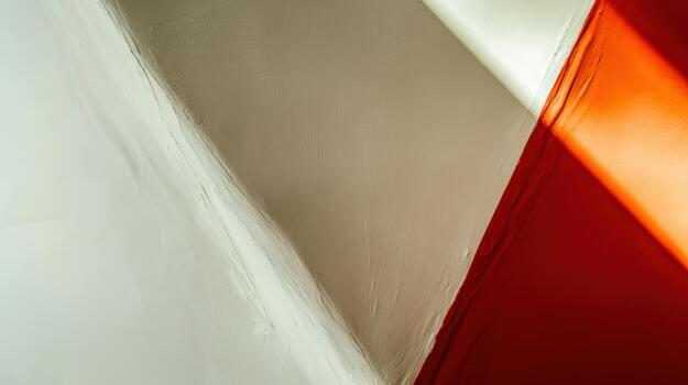 Light and shadow play against angled walls in an urban setting photo