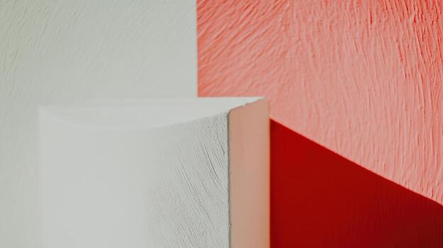 Abstract composition featuring textured walls in white and red hues photo